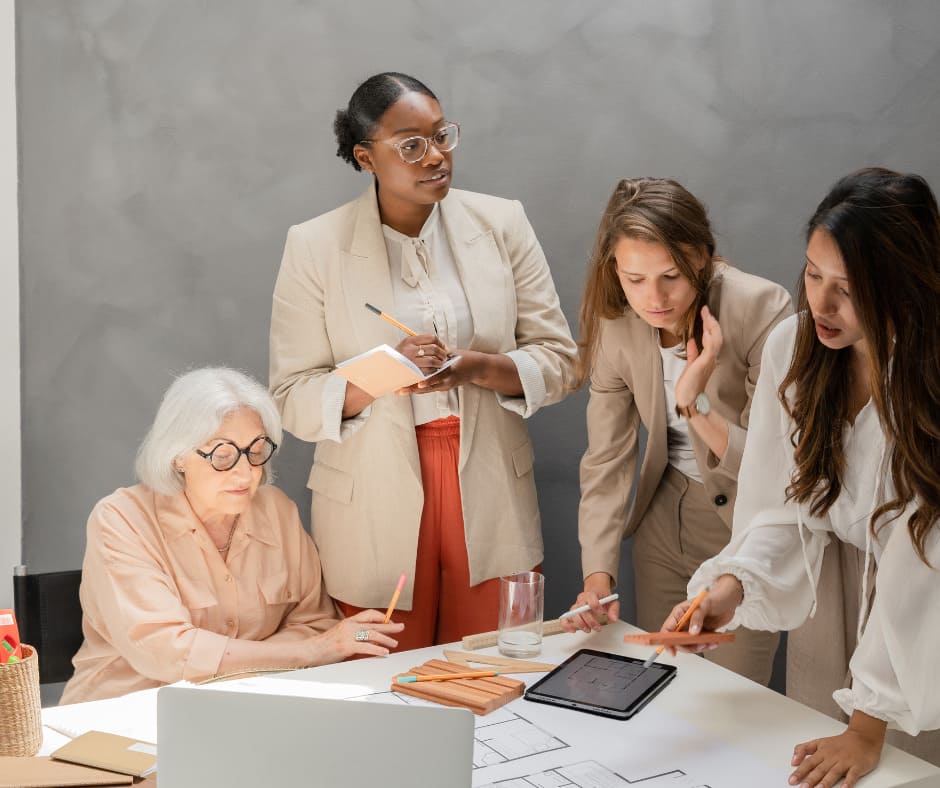 women collaborating around a table