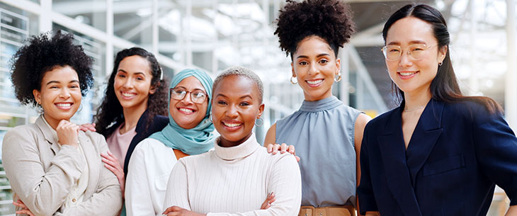 Group of smiling entreprenuerial women supporting each other