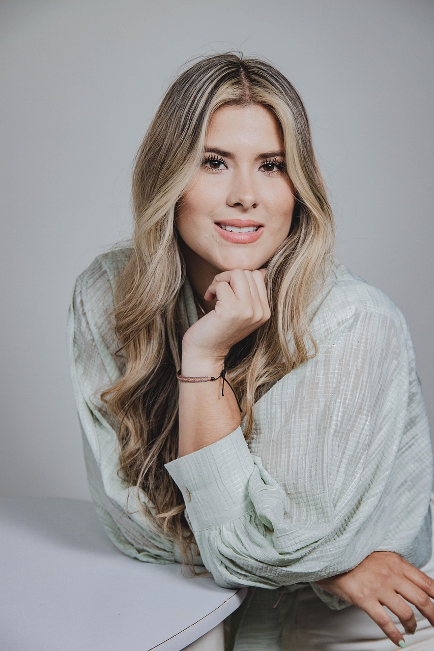 Smiling woman with long blonde hair representing fortune 500 companies with women CEOs.