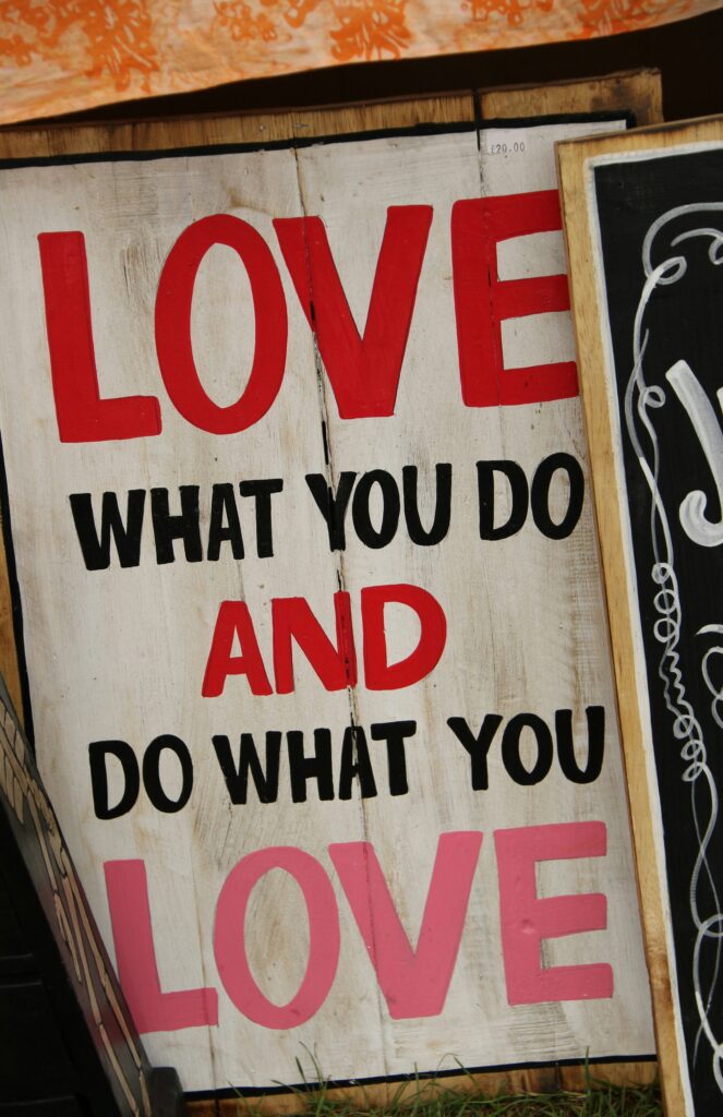 Positive quotes for women on office wall sign reading "love what you do and do what you love" - uplifting quotes for women in the workplace