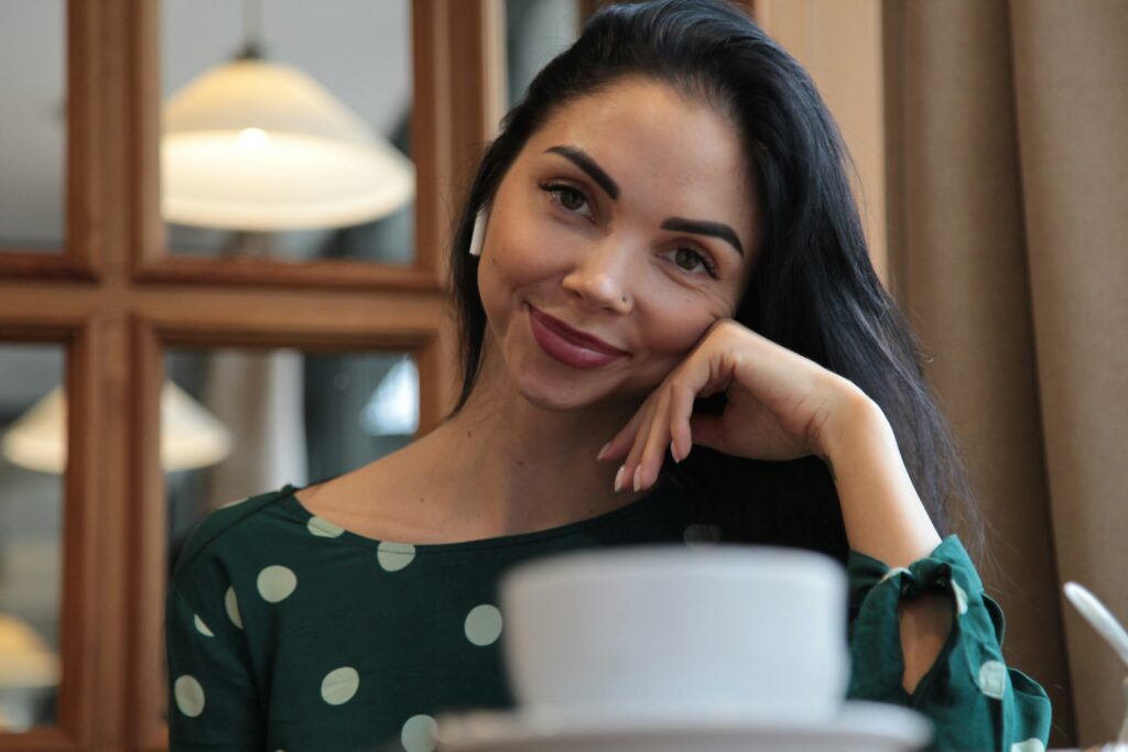 Professional woman ready to connect over coffee through women's leadership platforms that don't require Chief membership