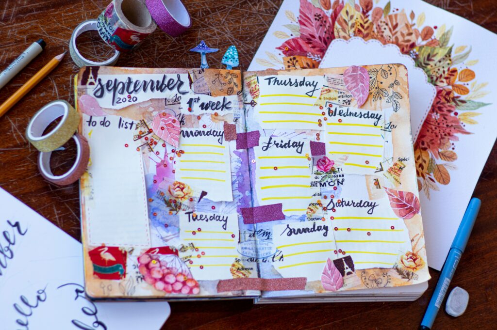 Weekly planner decorated with inspirational quotes for women and motivational cutouts featuring positive quotes for women for productivity