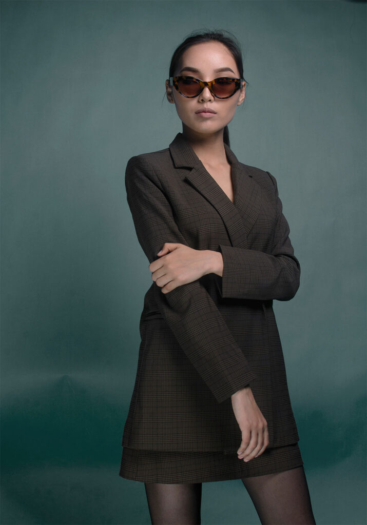 Woman in a short grey blazer dress